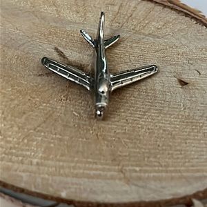 925 Sterling silver airplane charm.
